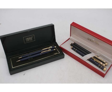 A cased Sheaffer Targa 1003 fountain pen, in matt black with gold trim, 14k Medium nib; together with another example in navy