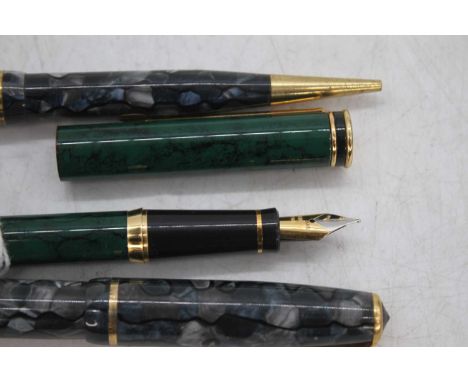 A Pelikan P70 Maxim fountain pen in marbled green, having gold trim and Iridium Point nib, 14cm; together with a Burnham B48 