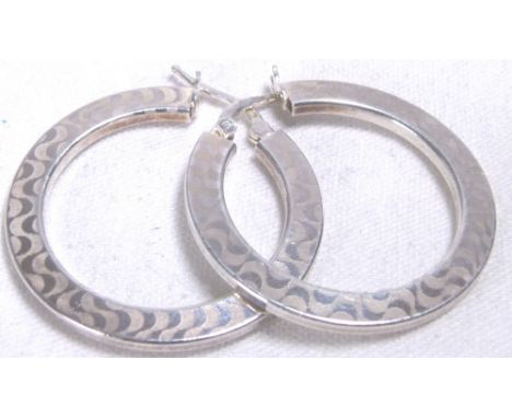 HOOP EARRINGS. Sterling silver fancy hoop earrings