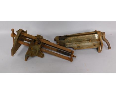 Two cast iron bench vices.