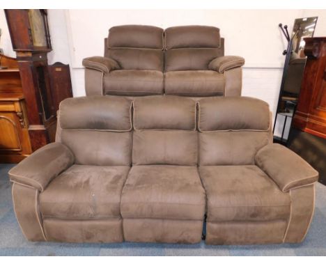 A brown suede three seater recliner sofa, and a two seater recliner sofa, with pale brown trim, 221cm long and 154cm long res