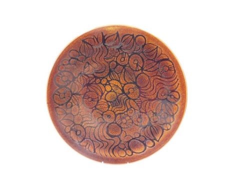 A Poole Pottery Aegean dish, decorated with stylised flowers against a mottled brown ground, shaped No 54, printed marks, 41.