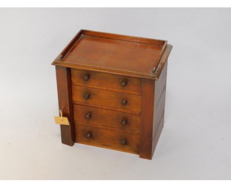 A small mahogany Wellington chest, formally part of a dressing table or desk, of four drawers, 40.5cm x 29cm x 41cm.