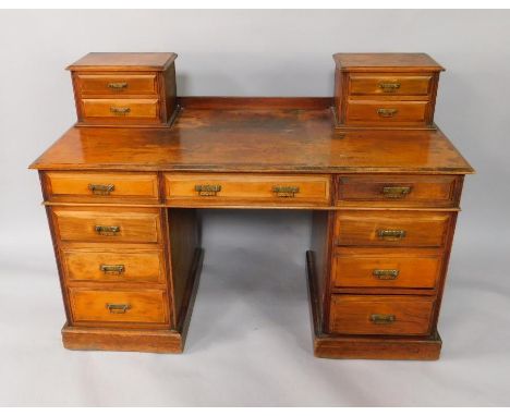 A Victorian mahogany twin pedestal desk by James Winter & Sons, of 151-155 Wardour Street, London, with four short drawers ov