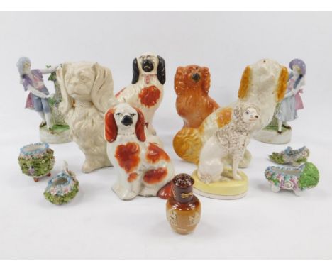 Staffordshire pottery flatback spaniels and other dogs, a pair of Continental late 19thC porcelain spill vases modelled with 