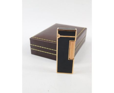 A Dunhill gold plated and black enamel Rollalite pocket lighter, No 105313, boxed.