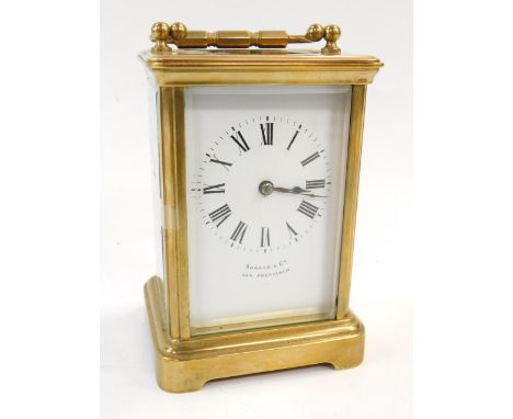 A brass cased carriage clock, for Shreve & Company, San Francisco, enamel dial bearing Roman numerals, twin barrel movement w