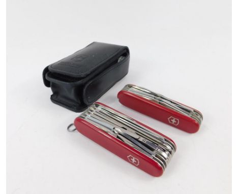 A Swiss Victorinox pocket survival kit, including a Swiss Army knife with twelve tools, and a seven tool Swiss Army knife, (2