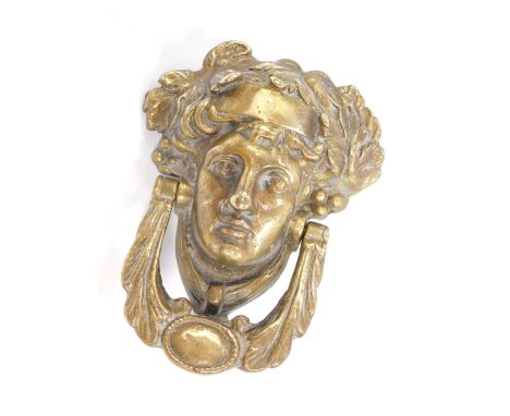 A heavy brass door knocker cast as Dionysus, 18.5cm high.