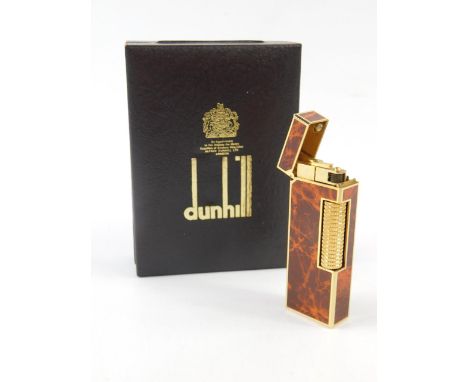 A Dunhill gold plated and faux wood pocket lighter, boxed with booklet.