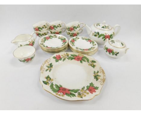 A Wedgwood porcelain part tea service decorated in the Starflower pattern, W4159, printed marks, comprising teapot, bread pla