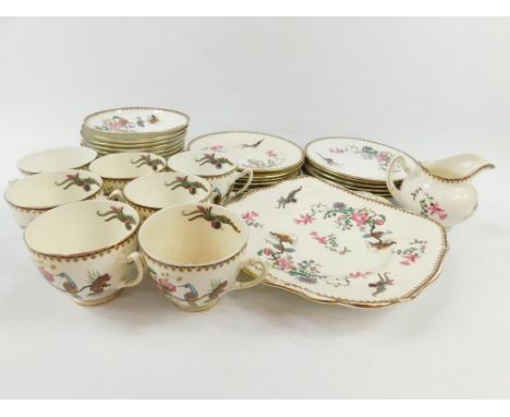 A Paragon early 20thC porcelain part tea service, decorated with exotic birds and flowers, C072, printed and painted marks, c