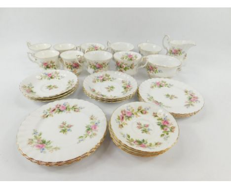A Royal Albert porcelain part tea and coffee service decorated in the Moss Rose pattern, comprising cream jug, sugar bowl, fi