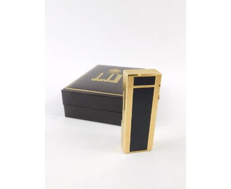 A Dunhill gold plated and black enamel Rollalite pocket lighter, boxed.