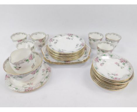 A Shelley early 20thC porcelain part tea service, decorated with pink flowers and buds, pattern no 293/3, printed and painted