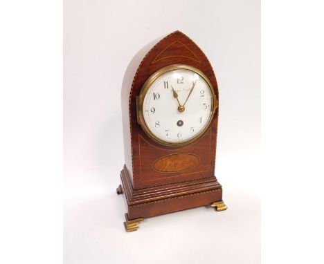 An Edwardian mahogany mantel clock, with inlaid and cross banded decoration, enamel dial bearing Arabic numerals, thirty hour