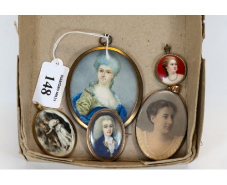 A late 18th / early 19th century oval miniature, head &amp; shoulders portrait of a young man, in a yellow metal mount, 4.5 x