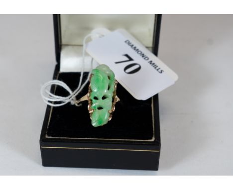 A 14K gold &amp; carved apple green jade ring, size P, not marked but tests 14K, est £100 - £150