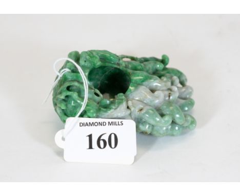 A finely carved 19th century Chinese apple green &amp; white jade brush washer, carved as a finger of fruit, with two playful