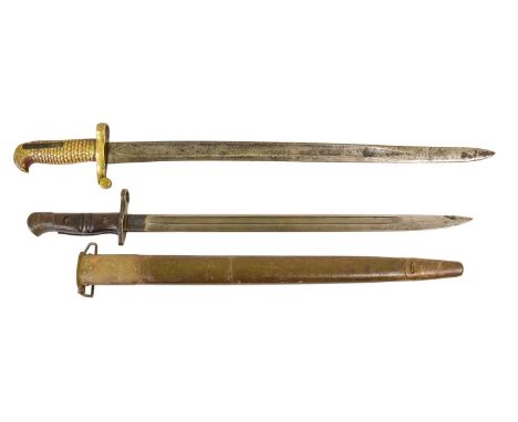 A 19th Century Yataghan Sword Bayonet, with 50cm unmarked steel blade, brass hilt with feathered/scalework grip, lacks scabba