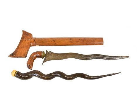 A 19th Century Buginese Kris, Sulawesi, with 39cm five lok pamor blade, the gilt metal mendak chased with leaves and with bea