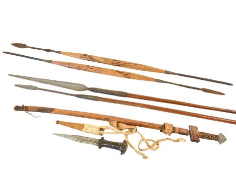 An African Takouba Type Sword, with 75cm single edge steel blade, leather bound cruciform hilt with layered aluminium cushion