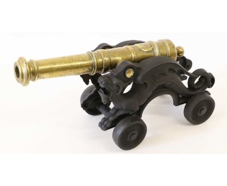 A Brass Model of a Signal Cannon, the 31cm ring knopped barrel with swollen muzzle and rounded cascabel, cylindrical trunnion