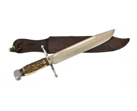 An Early 20th Century German Large Bowie Knife, the 25.5cm clip point steel blade marked STAINLESS GERMANY at the ricasso, th