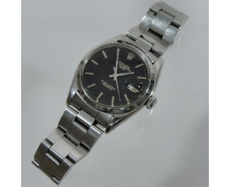A Rolex Oyster Perpetual Date Chronometer steel cased gentleman's wristwatch, the black dial with baton hours, on a flexible 