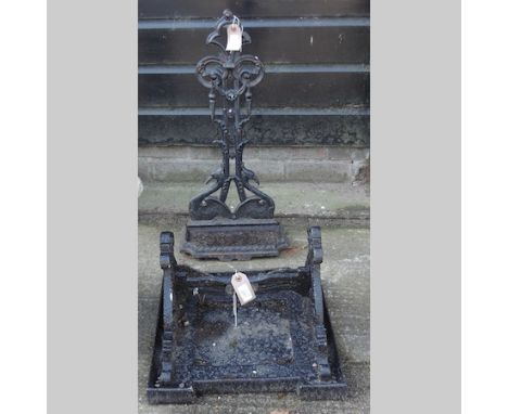 A large cast iron boot scraper, 29cm tall, together with a stick stand