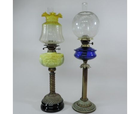 A Victorian brass oil lamp, with a blue glass reservoir and etched clear glass shade, 74cm tall overall,  together with a Vic
