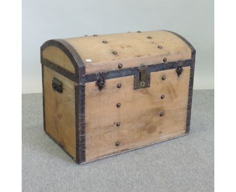 An antique pine and brass studded dome top trunk, 72cm