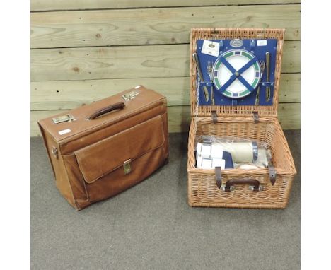 A leather briefcase, together with a fitted wicker picnic hamper