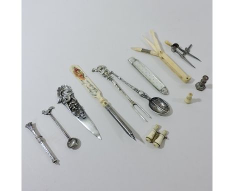 An early 20th century silver cased propelling pencil, together with a silver and mother of pearl fruit knife, various bone st