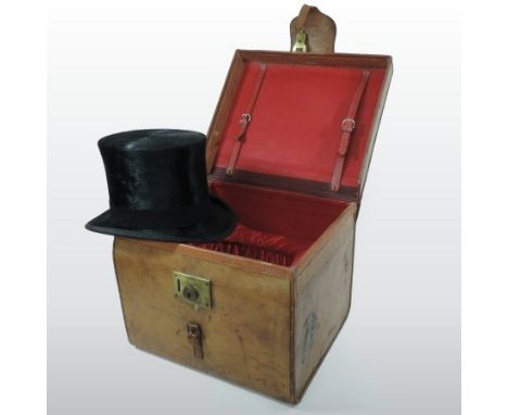 A Victorian gentleman's silk top hat, by the Army and Navy Cooperative Society Ltd, in original fitted leather case, with a r