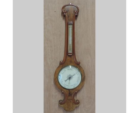 A Victorian walnut cased wheel barometer, by Ham and Huddy, Liskeard, 92cm tall