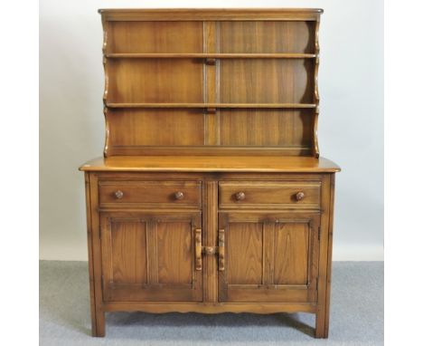 An Ercol elm dresser, with a plate rack, 122cm