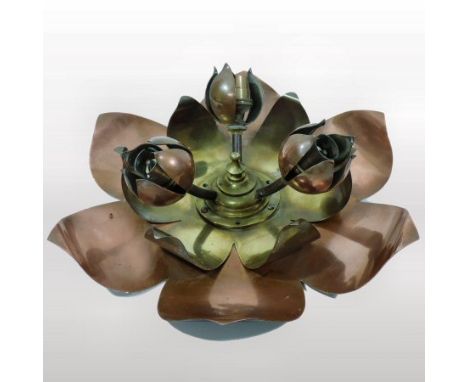 An Arts and Crafts brass and copper ceiling light, in the manner of W.A.S. Benson, of flower-head shape with three protruding