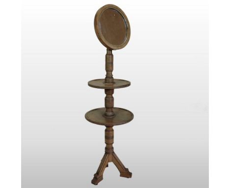 A Victorian ash two tier gentleman's shaving stand, by Gillows, with an adjustable circular mirror, on a tripod base, stamped