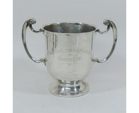 An early 20th century silver twin handled trophy cup, bearing inscription for Society of London Golf Captains, Parker Cups, e
