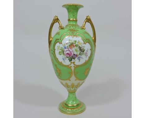 An early 20th century Royal Crown Derby porcelain vase, of ovoid pedestal shape, reserved with panels of coloured flowers, on