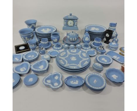 A large collection of Wedgwood Jasperware, to include a mantel clock, vases and trinket dishes