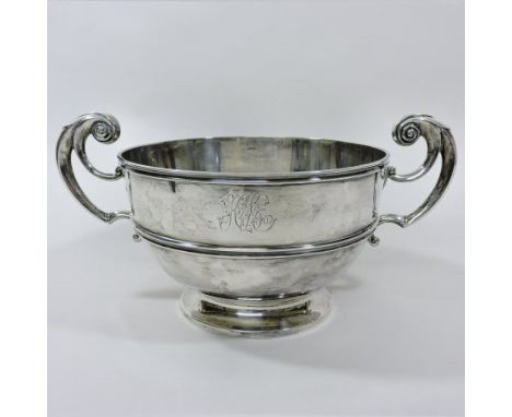 A Victorian silver twin handled bowl, with scrolled handles, on a pedestal base, by William Gibson & John Langman, London 189