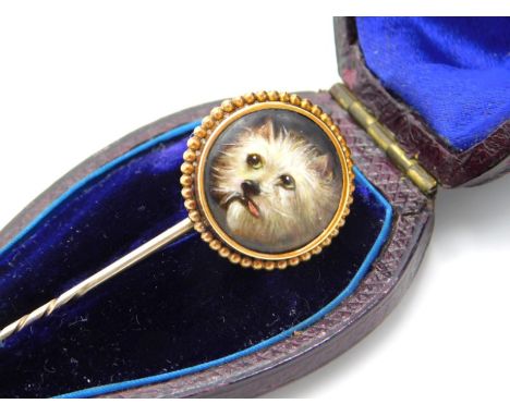 A 19thC. mid-Victorian yellow metal mounted hand painted William Essex enamel tie pin featuring West Highland terrier dog, si