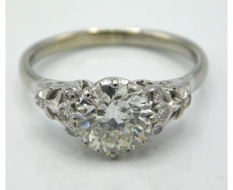 An antique 18ct white gold diamond ring set with a centre old European cut diamond of approx. 2ct & eight small stones in tot