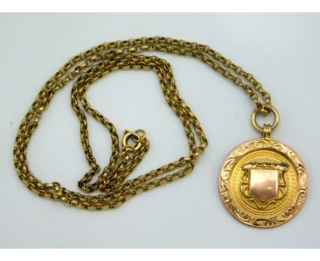 A 9ct gold 1920's sporting pendant inscribed to rear 'Stratford Friendly Aid Society v K. Div. of Police 1928', chain 22in lo
