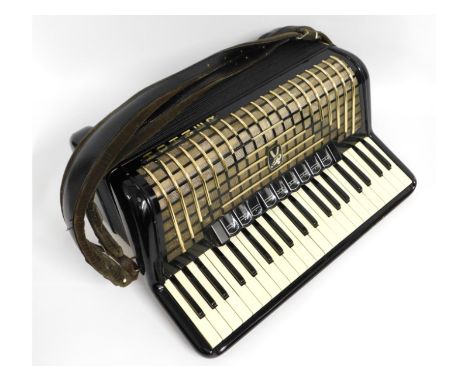 A full sized Hohner accordion with case