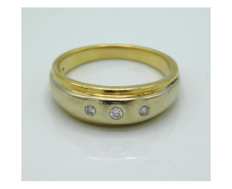 An 18ct gold ring set with three small diamonds, with certificate, 3.8g, size N