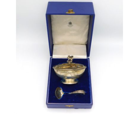 A cased Elizabeth II London silver sugar bowl, cover and ladle by Asprey & Co. to commemorate the Investiture of Charles, Pri