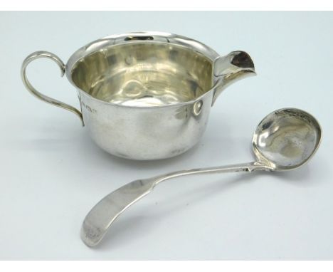 A 1923 Birmingham silver creamer of plain form by William Hutton & Sons twinned with an 1891 Victorian sauce ladle by Josiah 